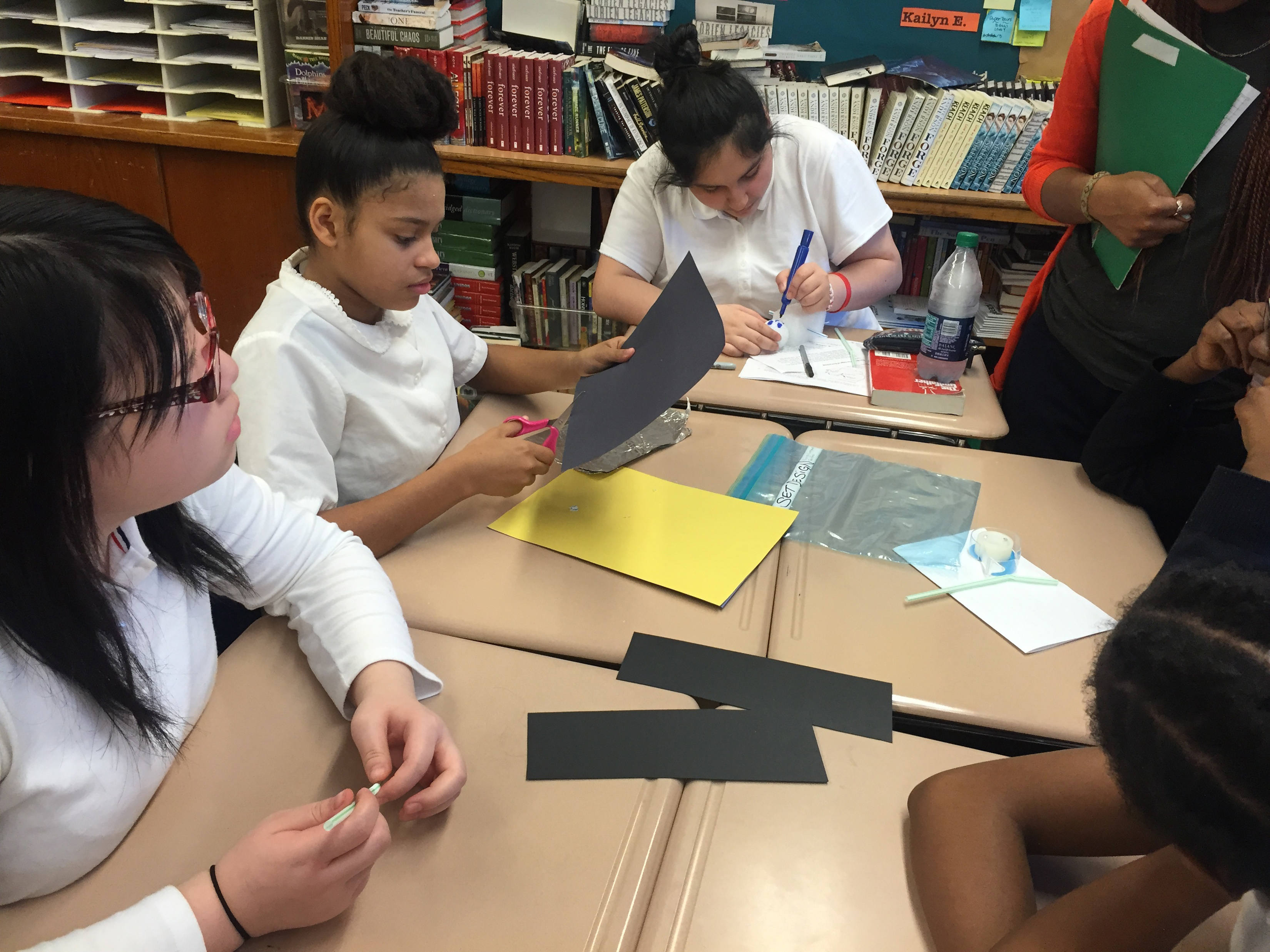 Arts in the Middle students cutting construction paper for a project